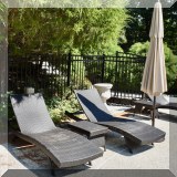 L03. 2 All-weather wicker lounge chairs. 